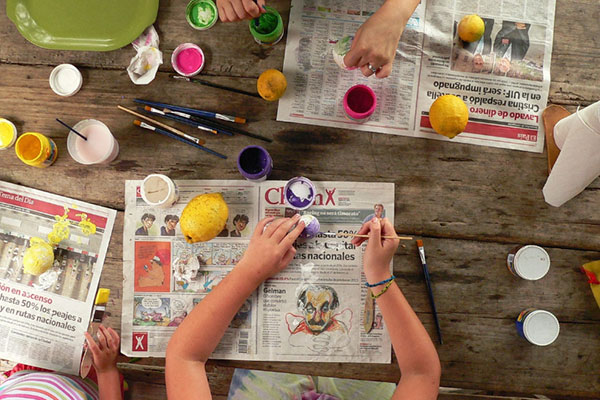 messy table with kids painting crafts